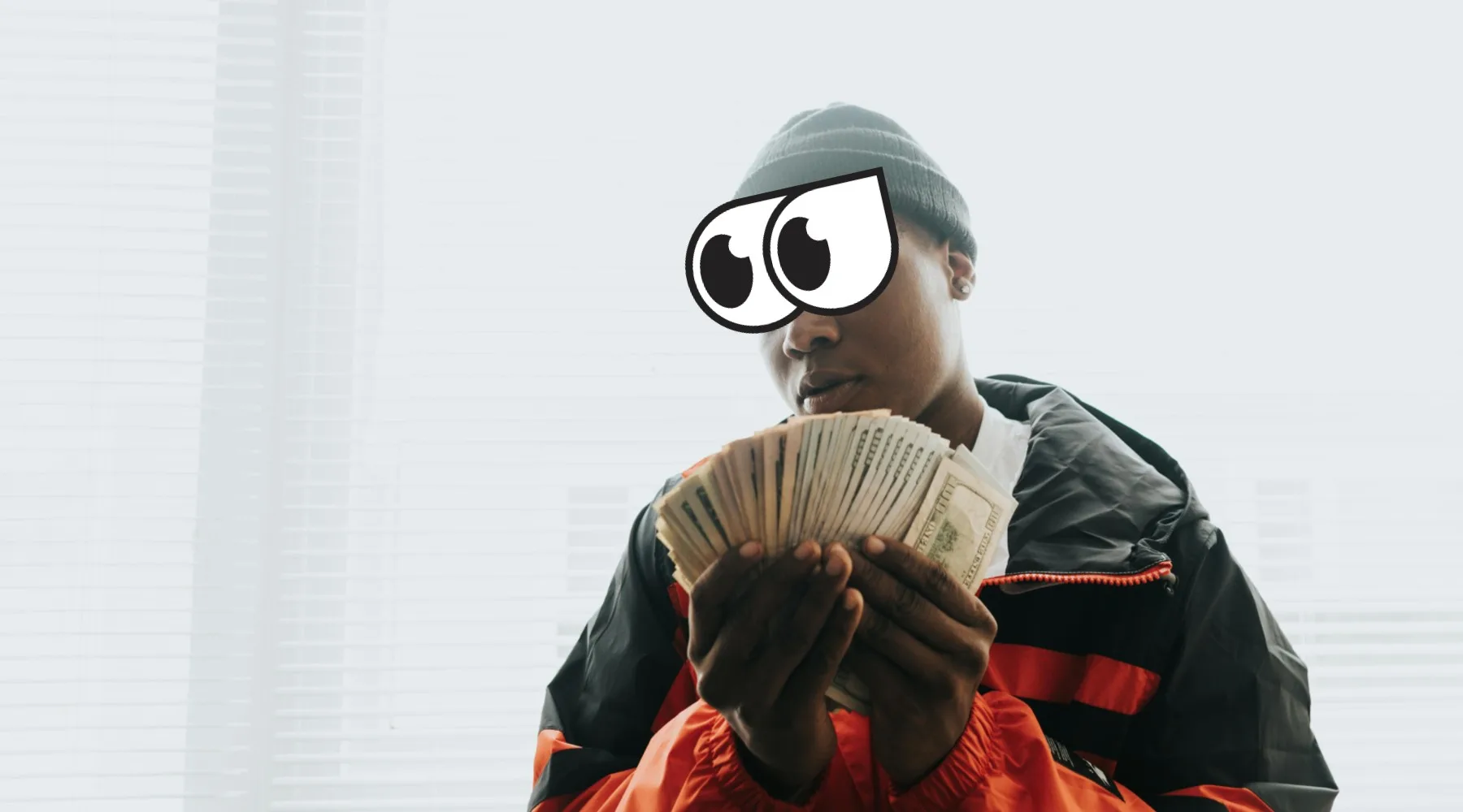 Man in Orange and Black Jacket Holding Plenty of Money