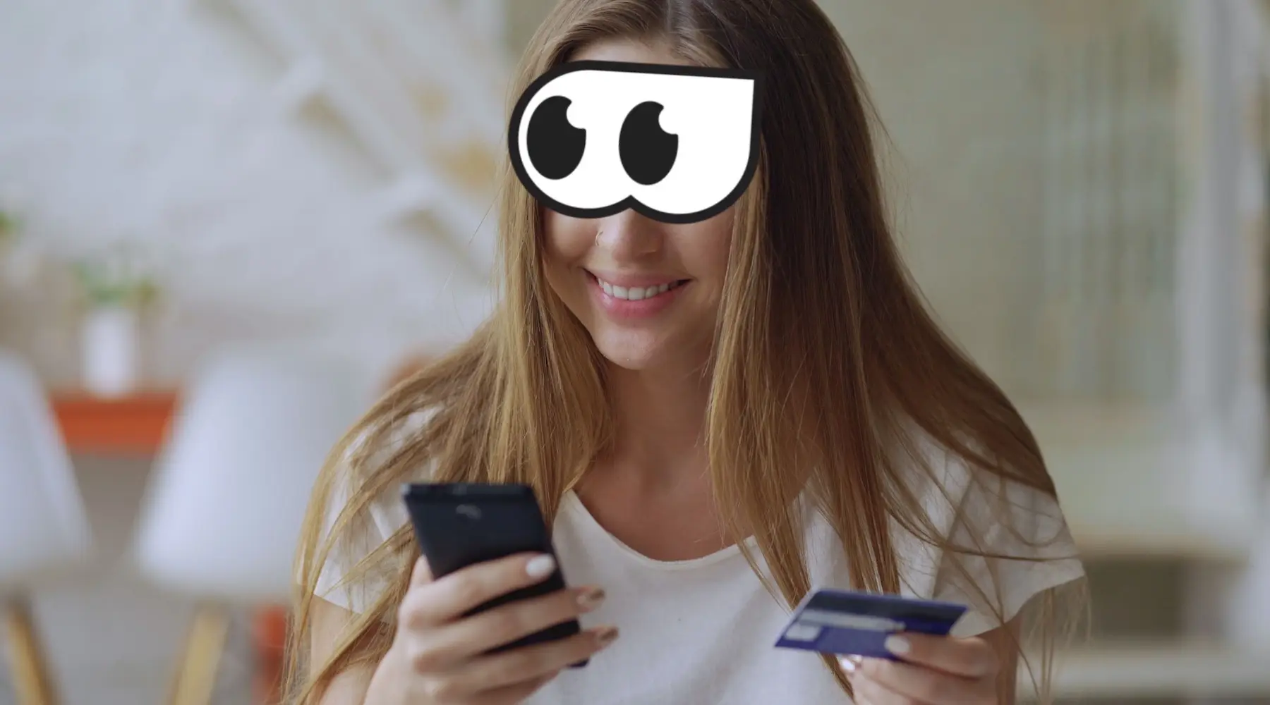 Woman using phone and card