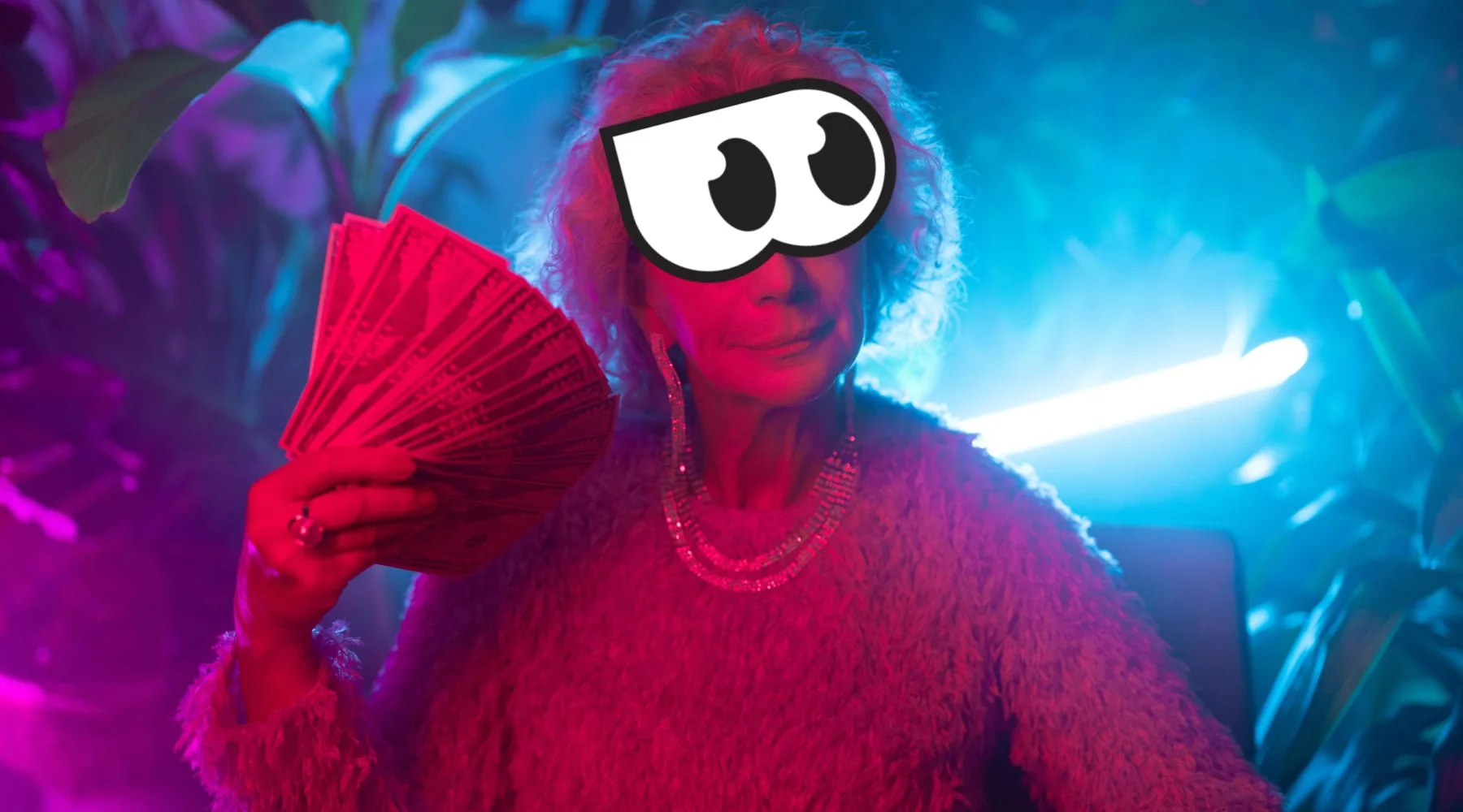 Woman holding wad of cash