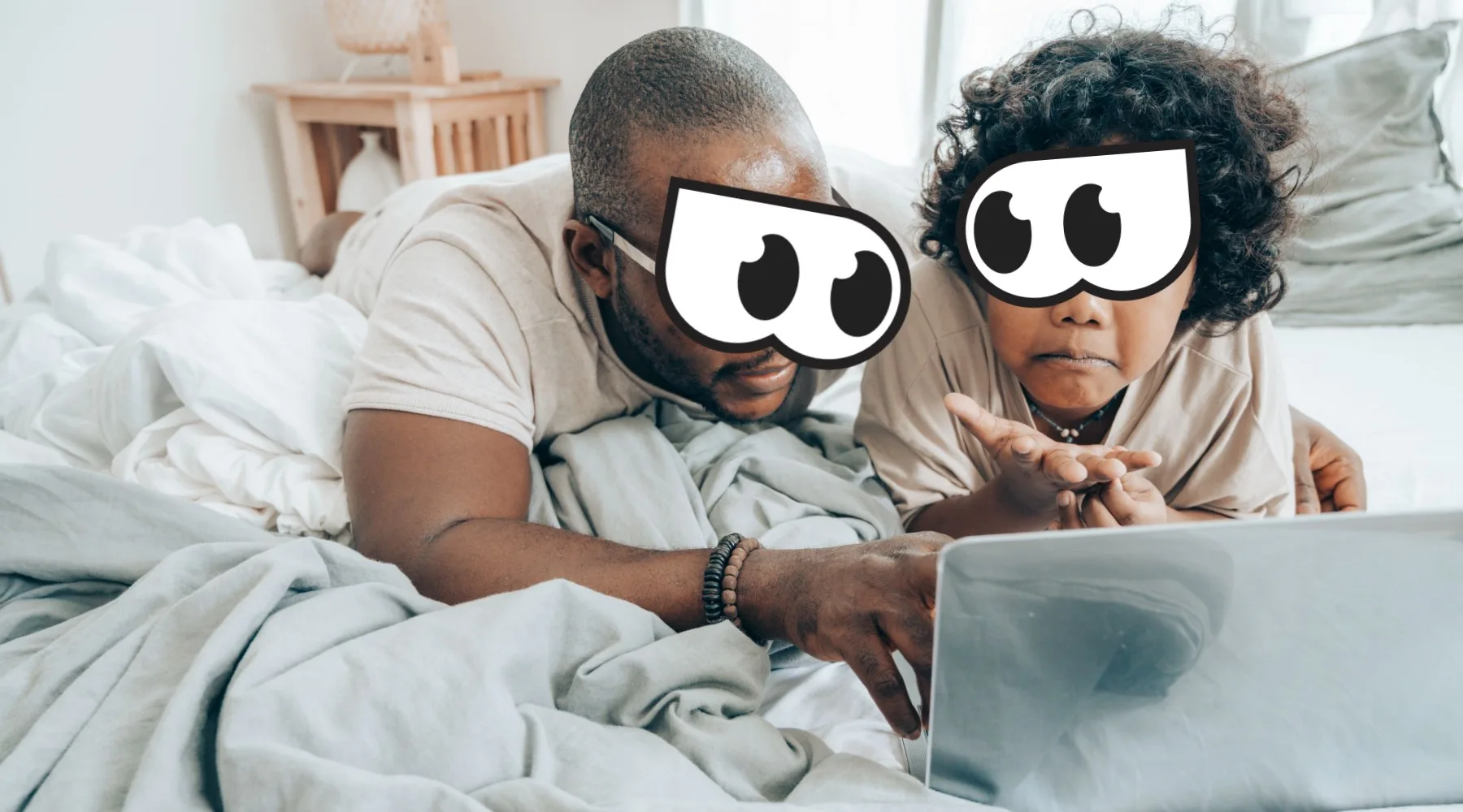 Man and child looking at laptop.