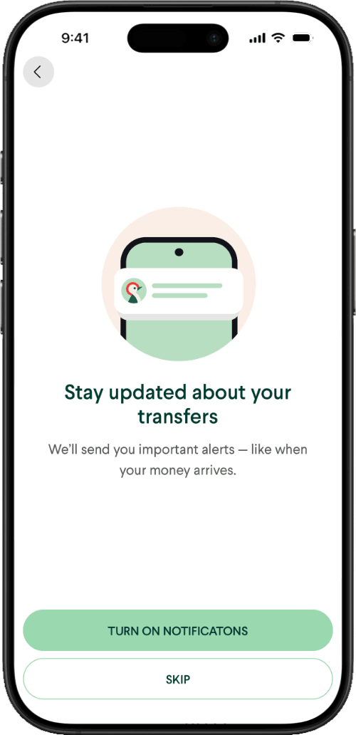 A smartphone with an international money transfer app open. The screenshot shows a prompt to enable alerts so that global transfers can be tracked to completion.