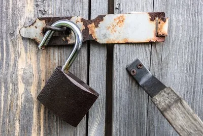 Unlocked rusty padlock