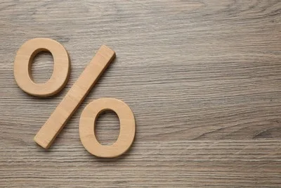 Percentage sign with a wood backdrop