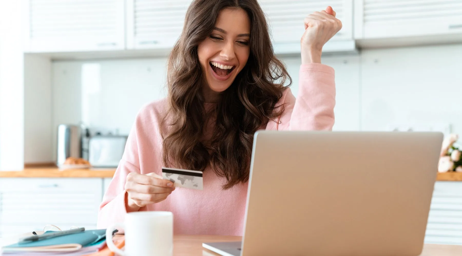 Smiling woman comparing credit cards in Canada