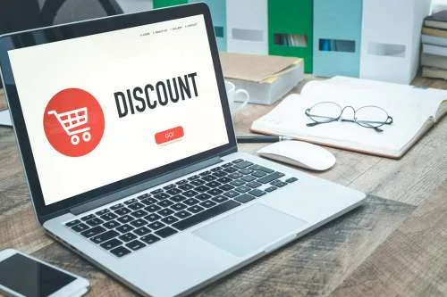 Computer displaying an online shop with discounts