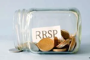 A glass jar lying on its side containing several gold and silver coins, with a paper label inside that reads "RRSP."
