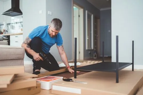 Man putting together a piece of furniture