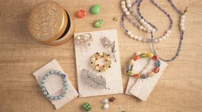 A close-up of some hand made bracelets and items.